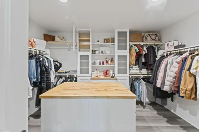 a view of a kitchen with fridge and closet