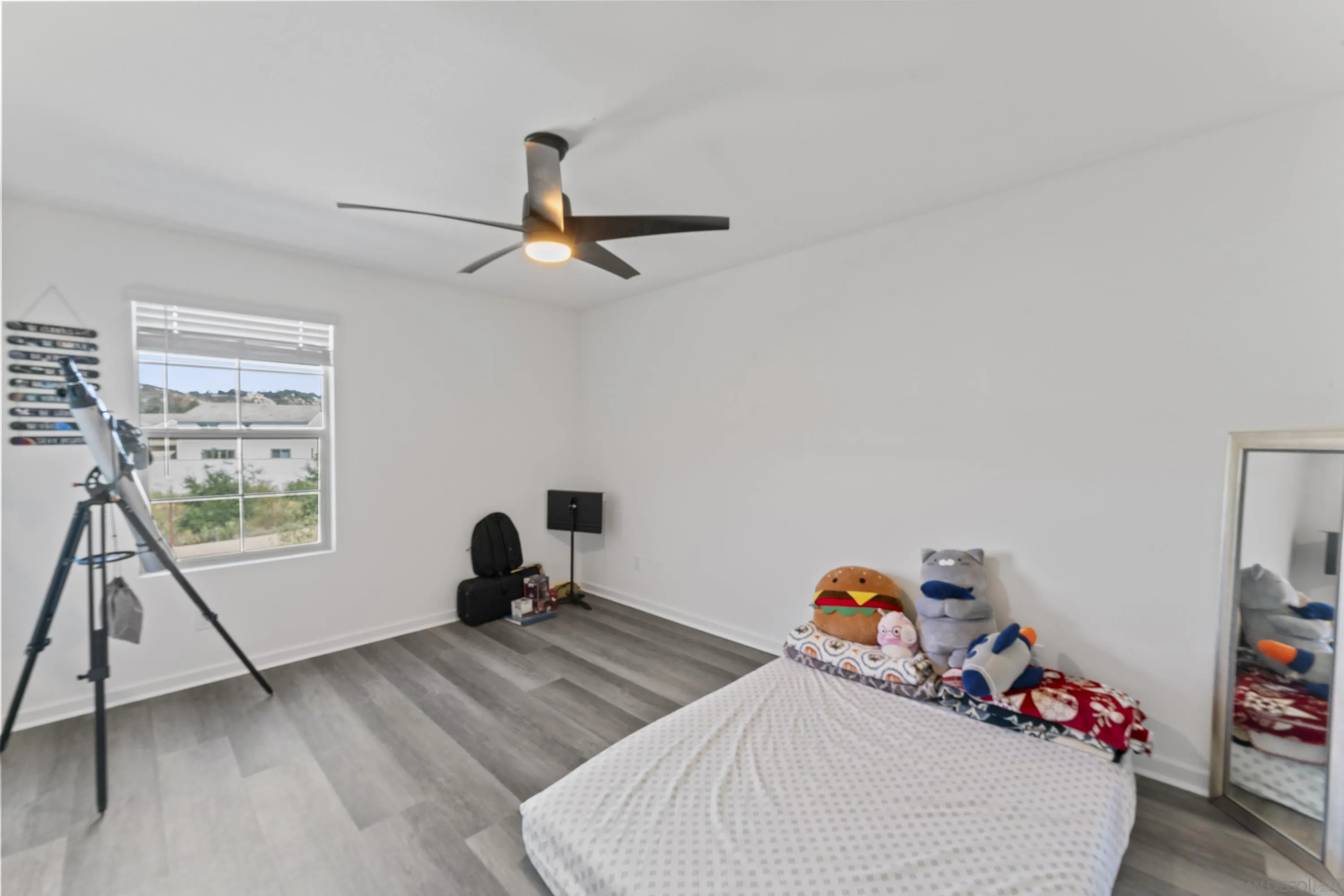 28032 Moosa Creek Way Valley Center Valley Center, CA 92082 - Photo 10 of 21 a bedroom with furniture and a window