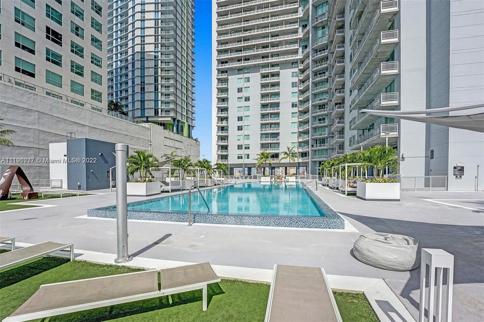 690 Southwest 1st Court, Unit 2926 Miami, FL 33130 - Photo 6 of 26 a view of a patio with a table and chairs