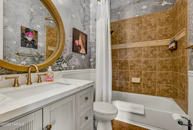 a view of a hallway with wooden floor and stairs