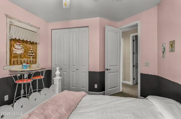 a living room with furniture and a lamp