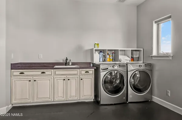a room with table chairs and windows