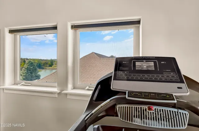 a view of a house with a yard porch and sitting area