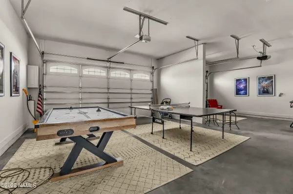 a view of a swimming pool and trees in the background