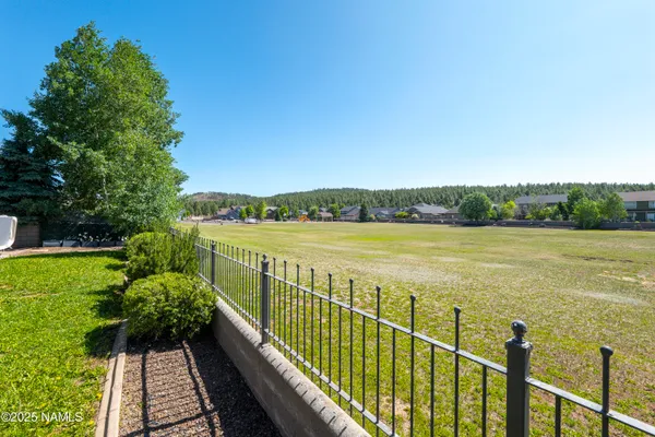 a view of a house with a yard porch and sitting area