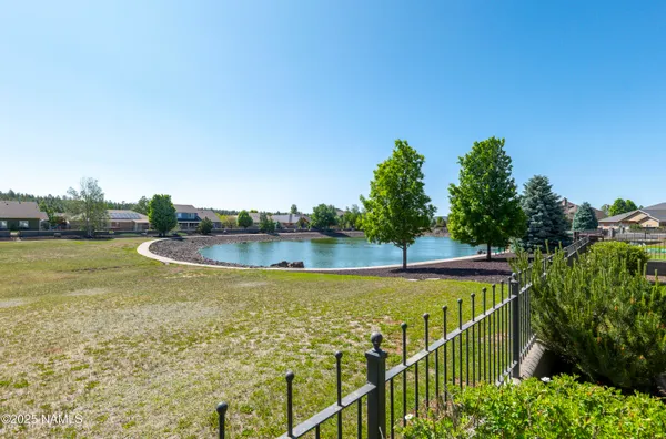 a front view of a house with a yard table and chairs