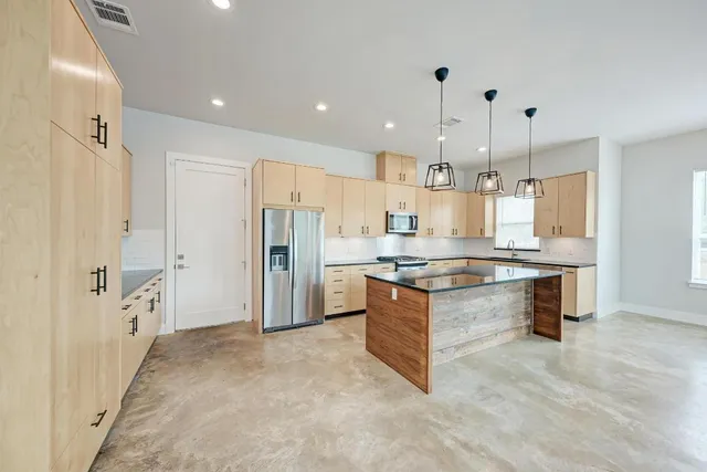 a large kitchen with cabinets