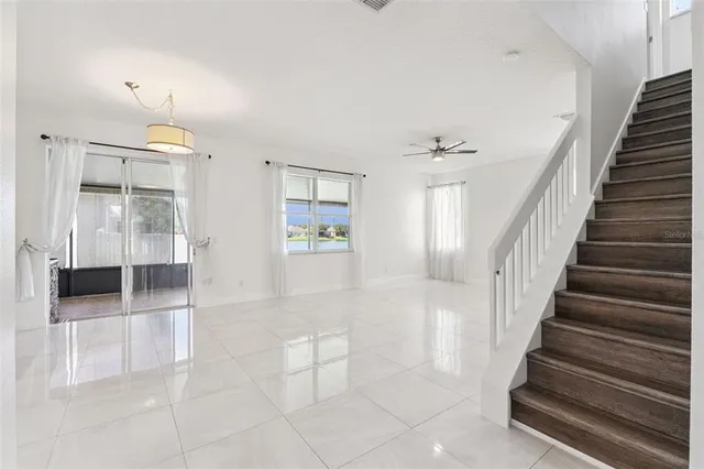 a view of a hallway view with staircase