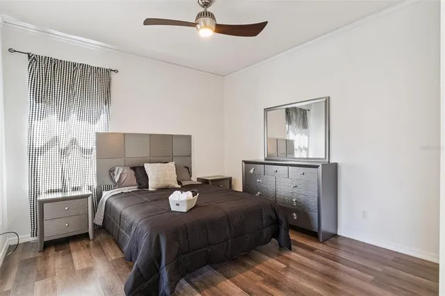 a bedroom with a bed and a night stand