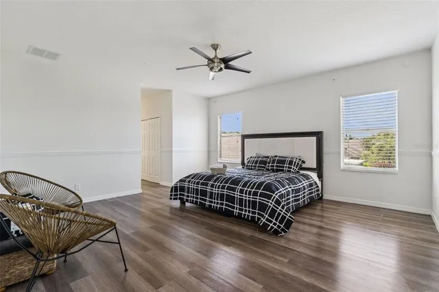 a bedroom with a bed and window