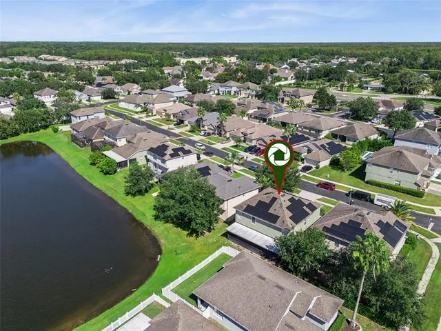 an aerial view of a house with a garden