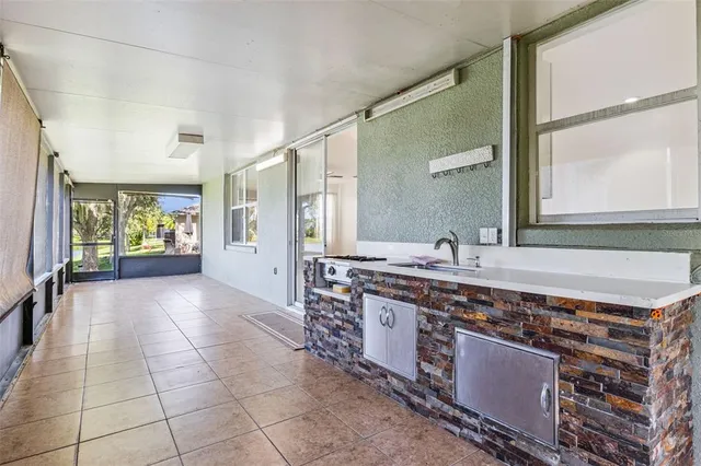 a large bathroom with a granite countertop sink and a mirror