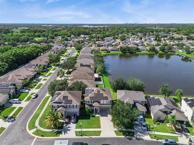 an aerial view of a house with a lake view