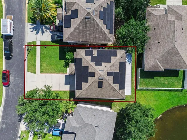 an aerial view of a house with a garden and plants