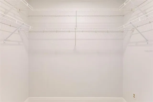 a bathroom with a sink double vanity mirror and a bathtub