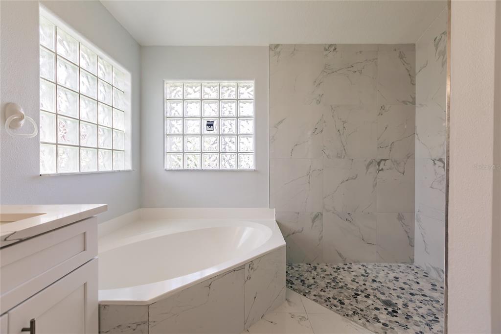 1304 Islamorada Boulevard Punta Gorda, FL 33955 - Photo 20 of 45 a bathroom with a sink a toilet and shower