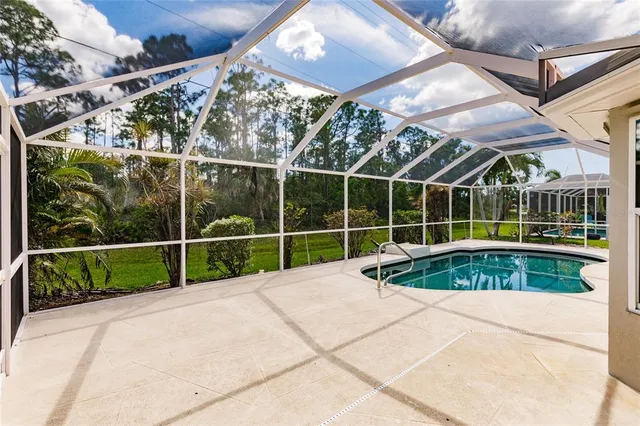a house with a large pool in front of it