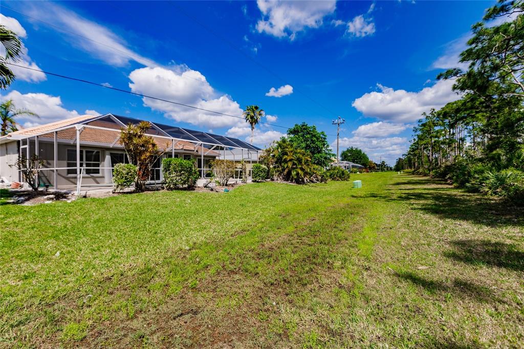 1304 Islamorada Boulevard Punta Gorda, FL 33955 - Photo 38 of 45 a view of a house with a big yard