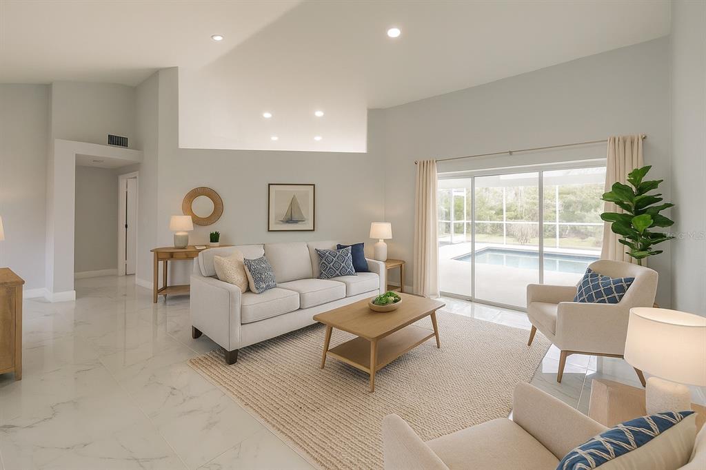 1304 Islamorada Boulevard Punta Gorda, FL 33955 - Photo 7 of 45 a living room with furniture and a large window