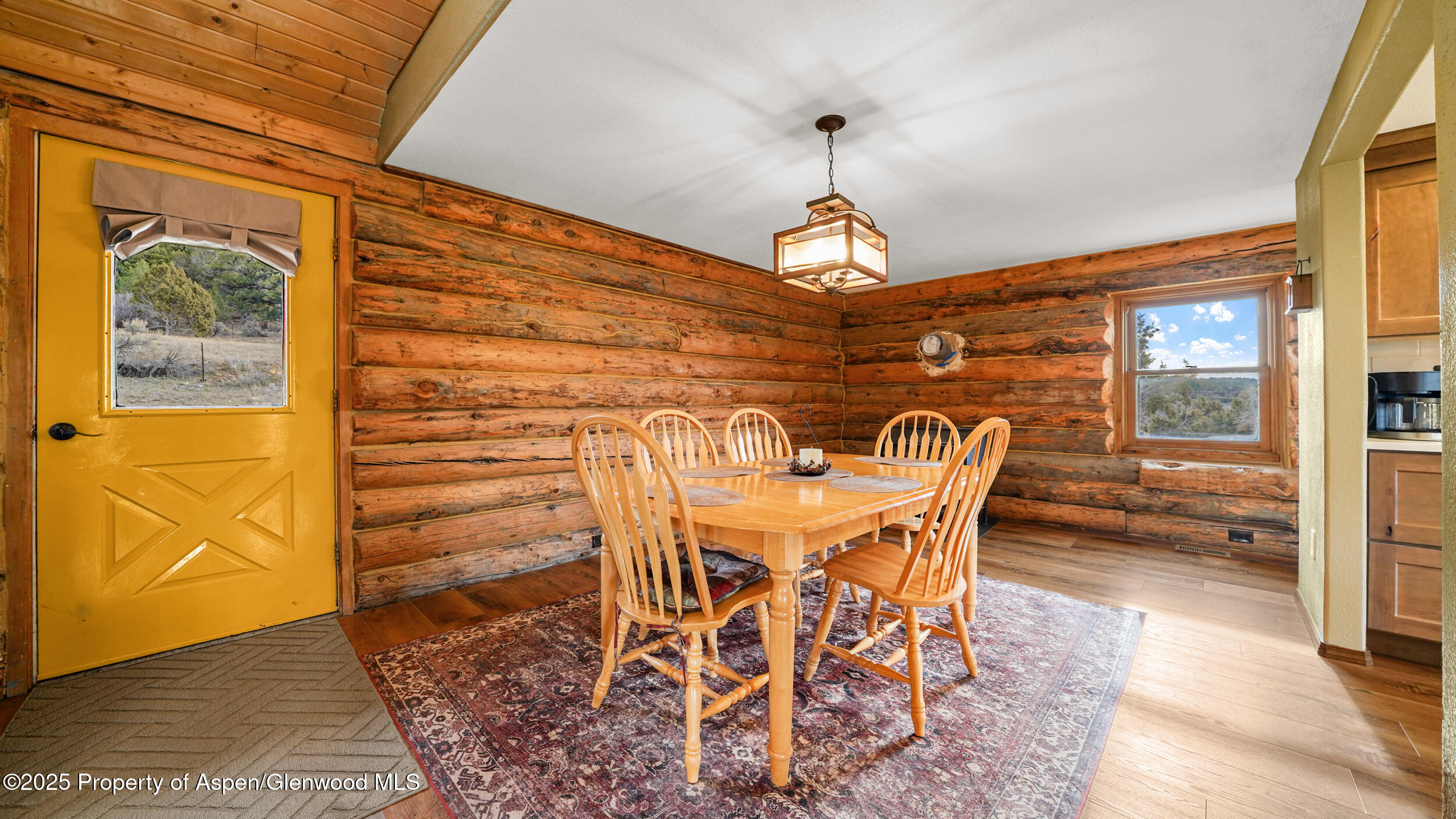 41 County Road 9 Meeker, CO 81641 - Photo 16 of 43 a view of a dining room with furniture and wooden floor