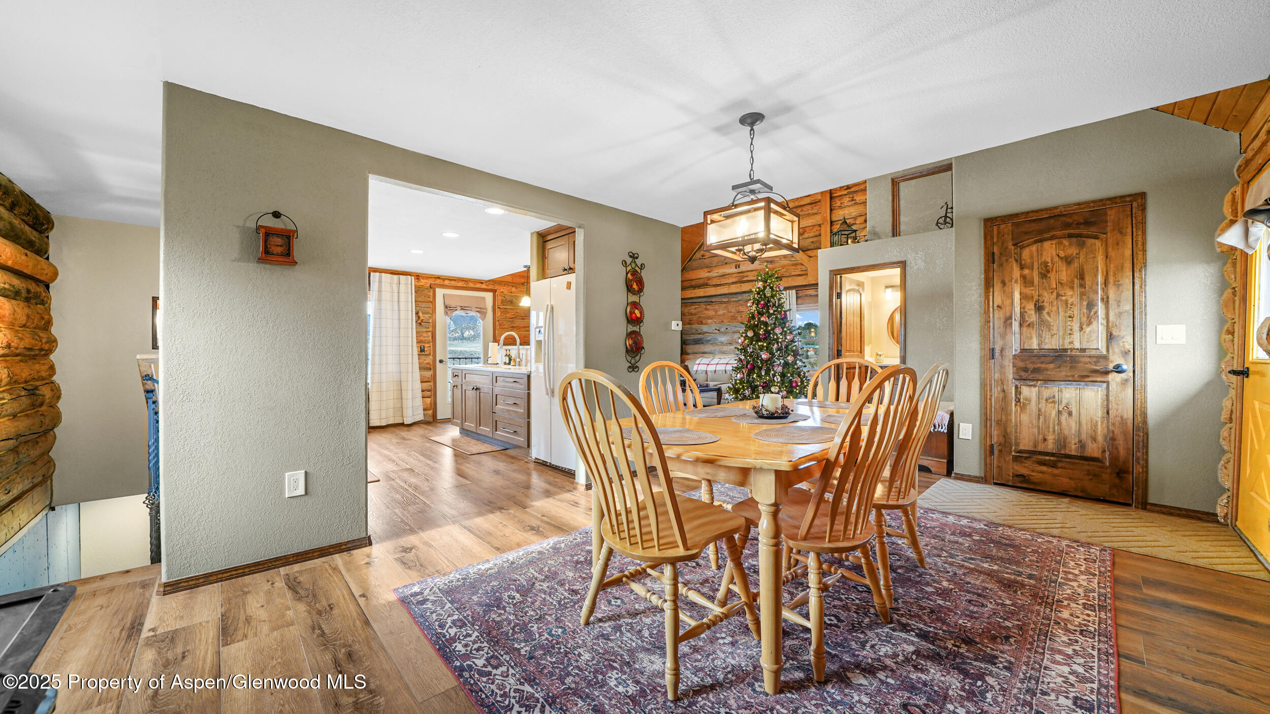 41 County Road 9 Meeker, CO 81641 - Photo 18 of 43 a view of a dining room with furniture window and wooden floor