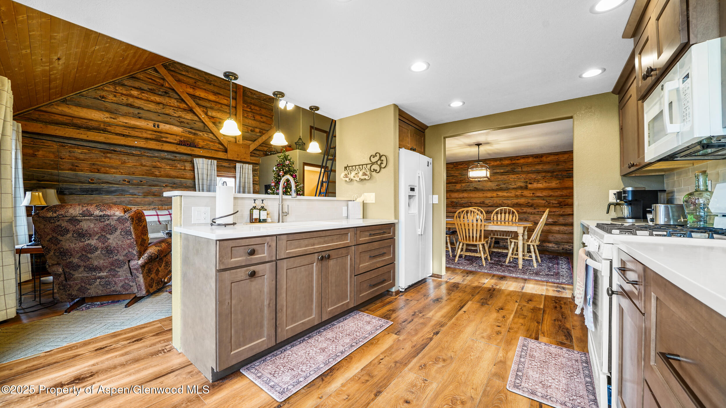 41 County Road 9 Meeker, CO 81641 - Photo 6 of 43 a large kitchen with a sink and dishwasher a oven with wooden cabinets