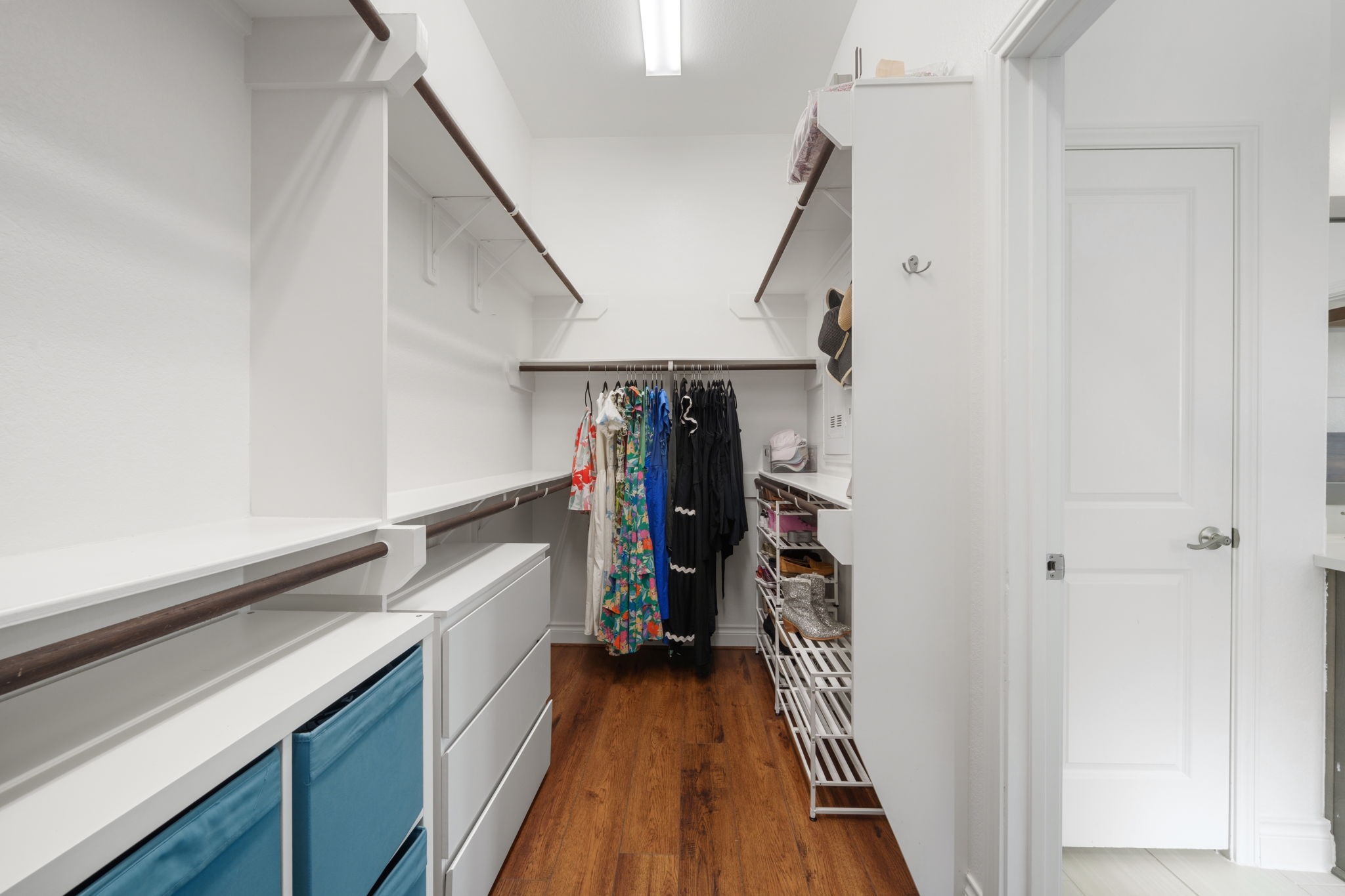 2119 Blackhawk Ridge Lane Manvel, TX 77578 - Photo 19 of 49 Generously sized primary walk-in closet featuring dual hanging rods on both sides - offering exceptional organization and storage space.