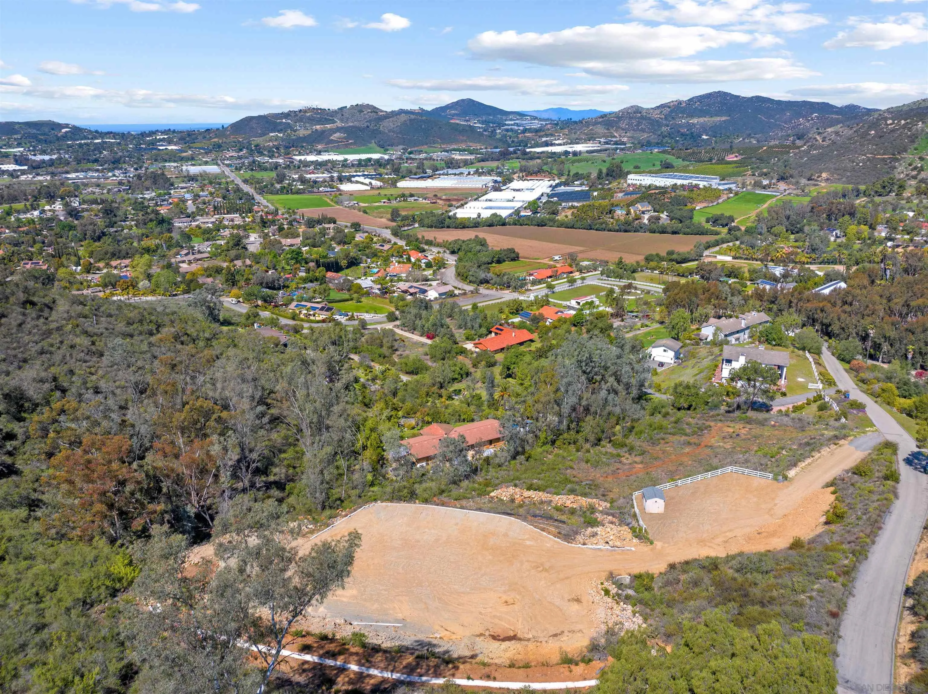 827 Eucalyptus Woods Road, Unit R006 San Marcos, CA 92069 - Photo 18 of 34 a view of a city with mountains in the background