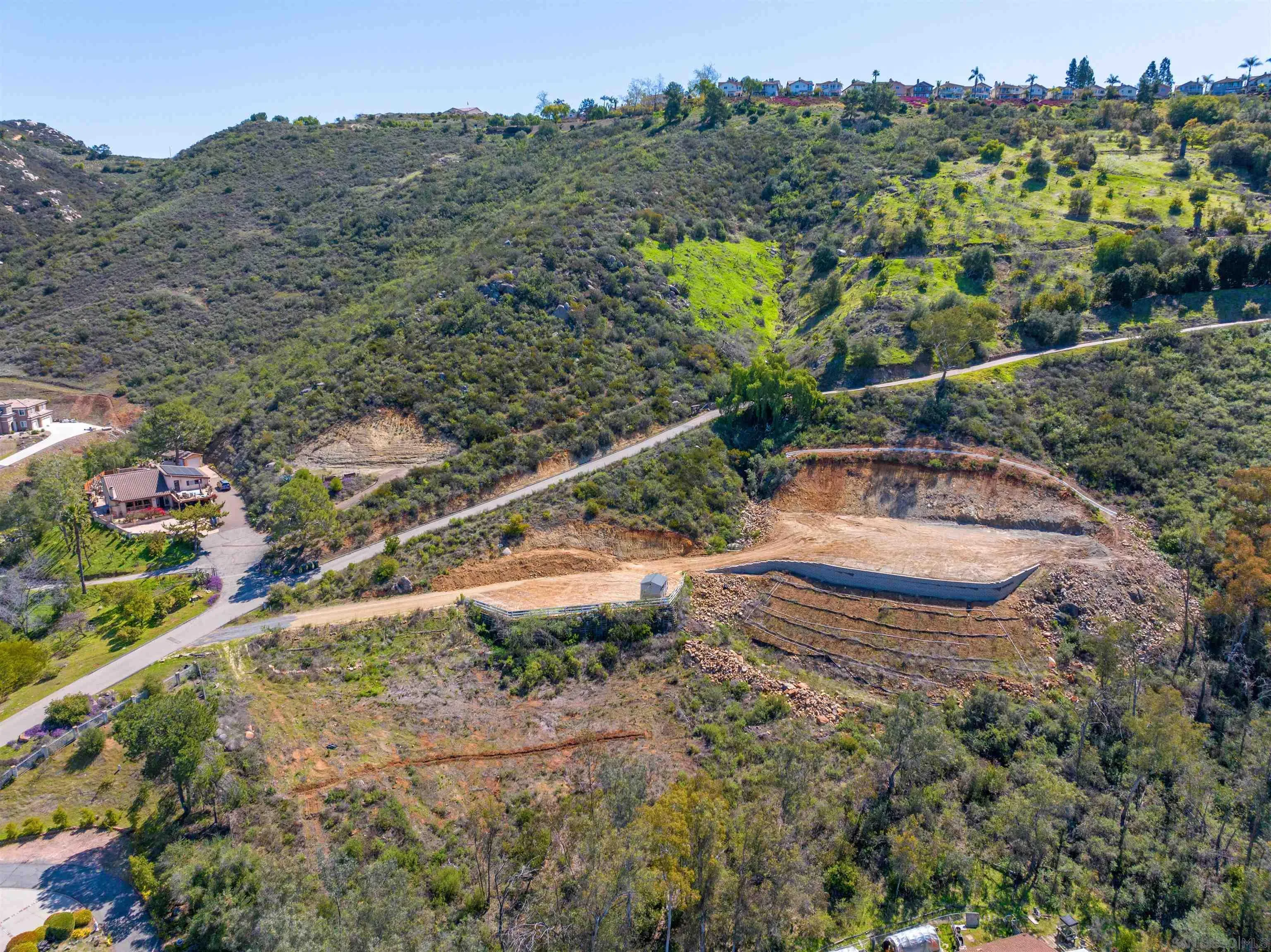 827 Eucalyptus Woods Road, Unit R006 San Marcos, CA 92069 - Photo 31 of 34 a view of a houses with a yard