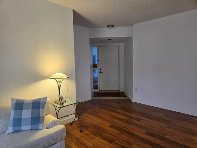 a living room with a table and chairs
