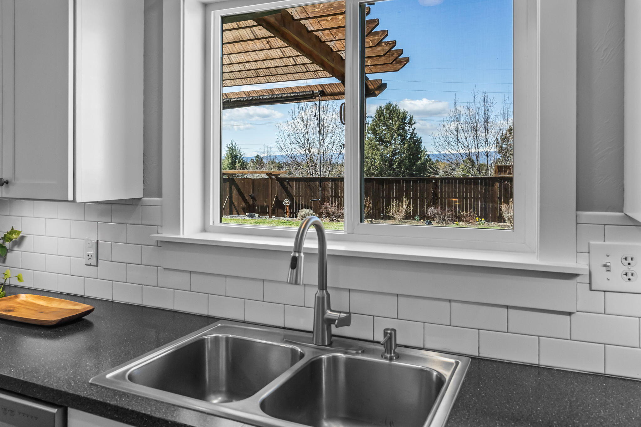 61600 Ward Road Bend, OR 97702 - Photo 11 of 52 a kitchen with a sink and cabinet