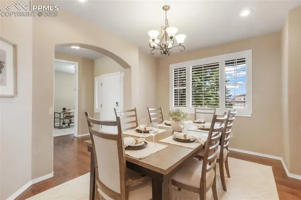 a view of a dining room with furniture window and wooden floor