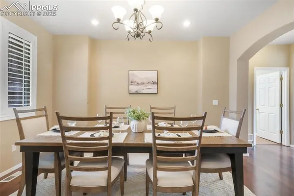 a view of a dining room with furniture and wooden floor