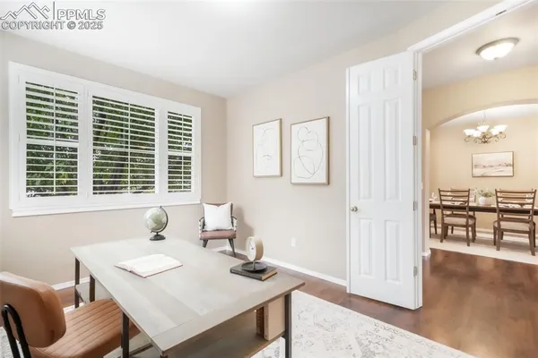 a view of a dining room with furniture and wooden floor