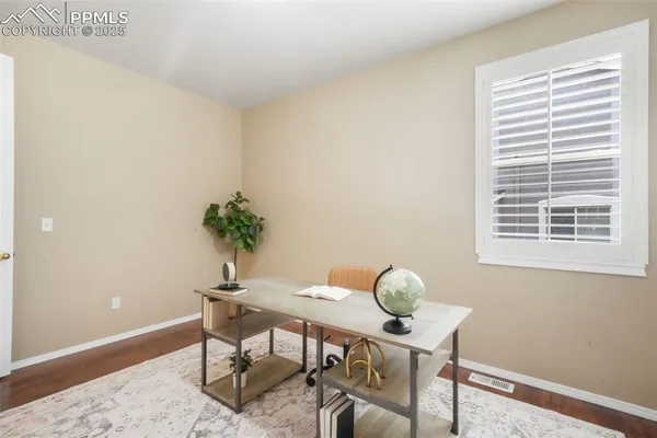 a view of a workspace with furniture