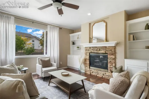a living room with furniture and a fireplace