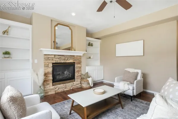 a living room with furniture and a fireplace