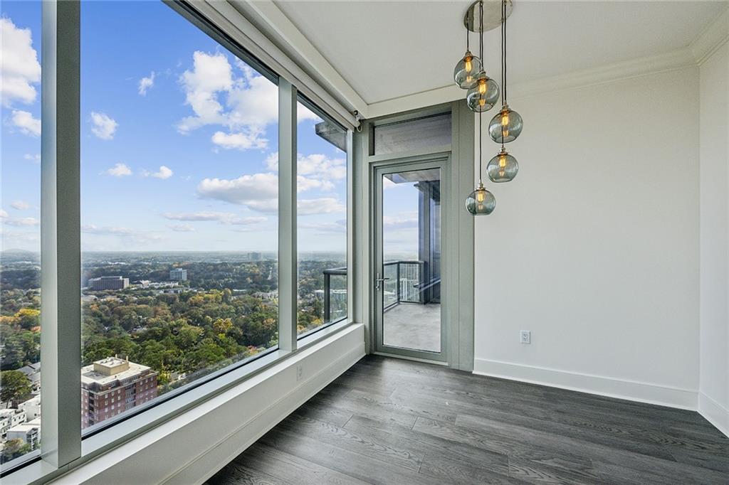 3630 Peachtree Road Northeast, Unit 3106 Atlanta, GA 30326 - Photo 11 of 41 a view of a room with wooden floor and windows