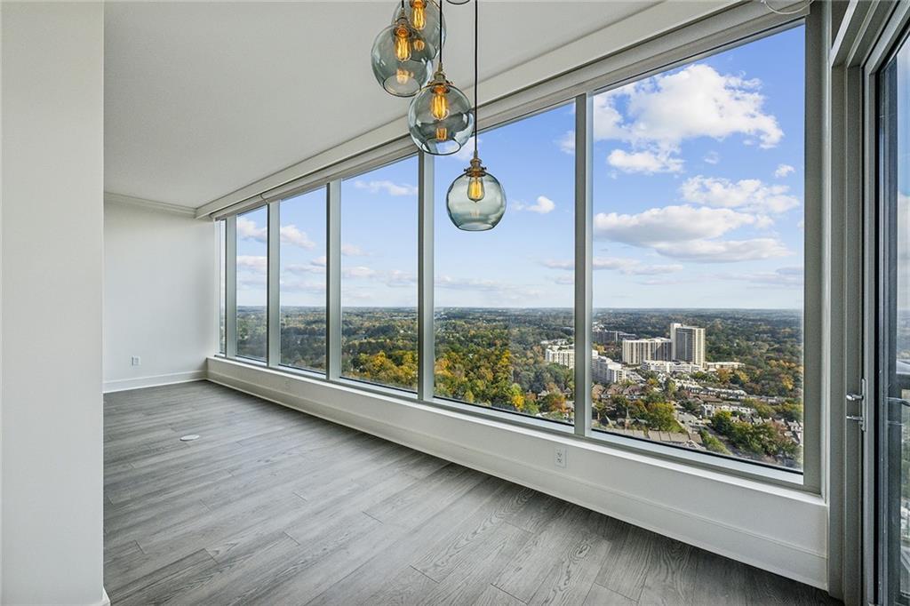 3630 Peachtree Road Northeast, Unit 3106 Atlanta, GA 30326 - Photo 12 of 41 a view of room with window and hardwood floor