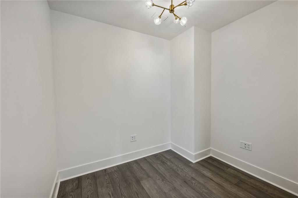 3630 Peachtree Road Northeast, Unit 3106 Atlanta, GA 30326 - Photo 18 of 41 wooden floor in an empty room