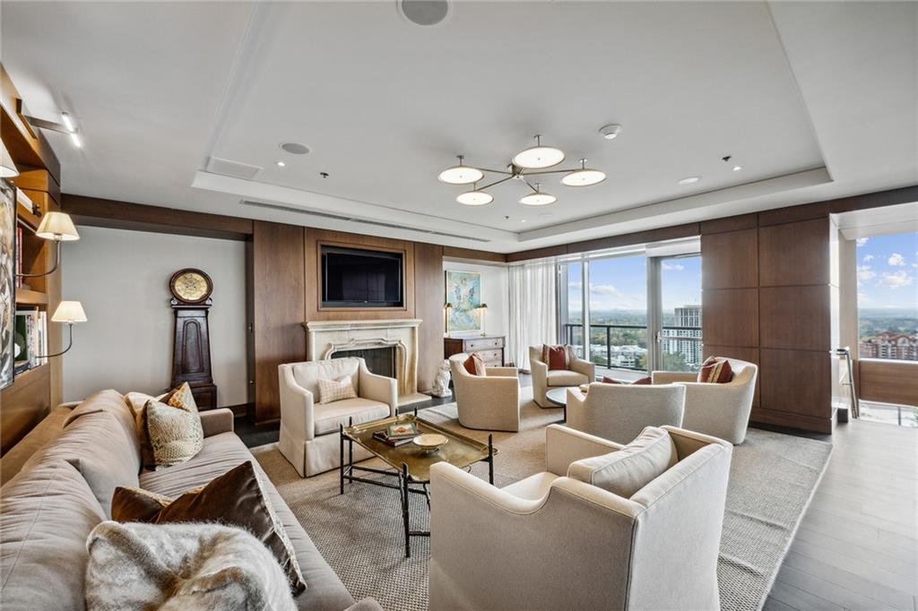 3630 Peachtree Road Northeast, Unit 3106 Atlanta, GA 30326 - Photo 23 of 41 a living room with furniture and a large window