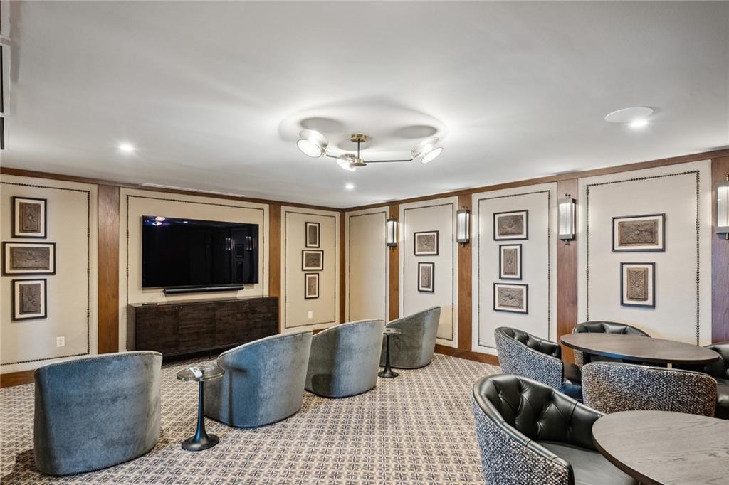 3630 Peachtree Road Northeast, Unit 3106 Atlanta, GA 30326 - Photo 26 of 41 a living room with furniture and a flat screen tv