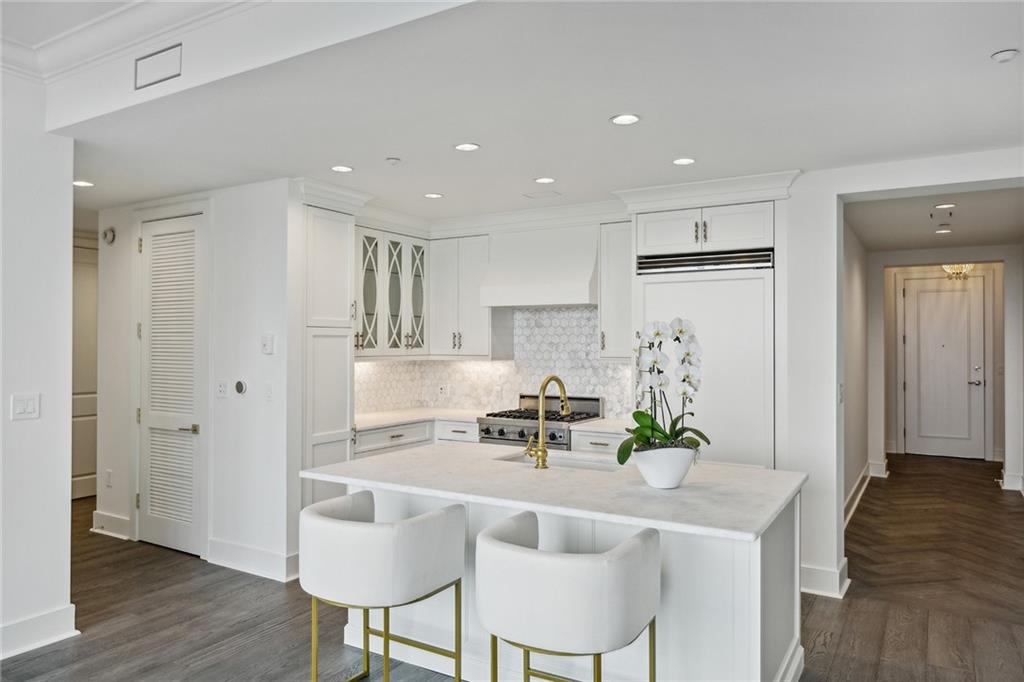 3630 Peachtree Road Northeast, Unit 3106 Atlanta, GA 30326 - Photo 3 of 41 a kitchen with kitchen island cabinets and refrigerator