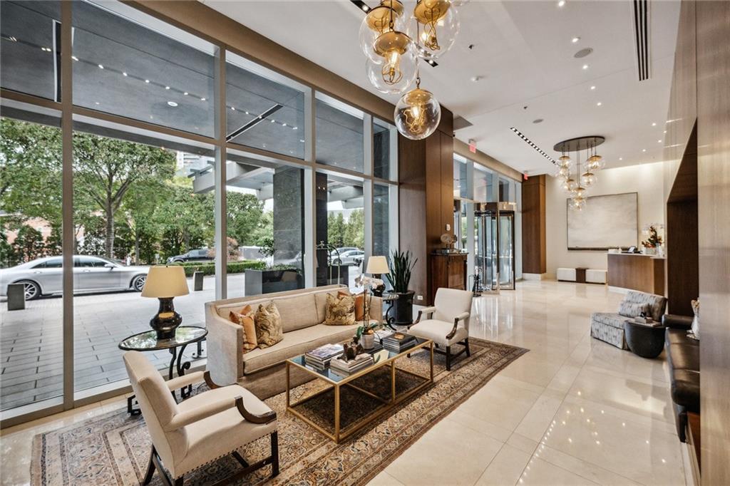 3630 Peachtree Road Northeast, Unit 3106 Atlanta, GA 30326 - Photo 37 of 41 a living room with furniture and a large window