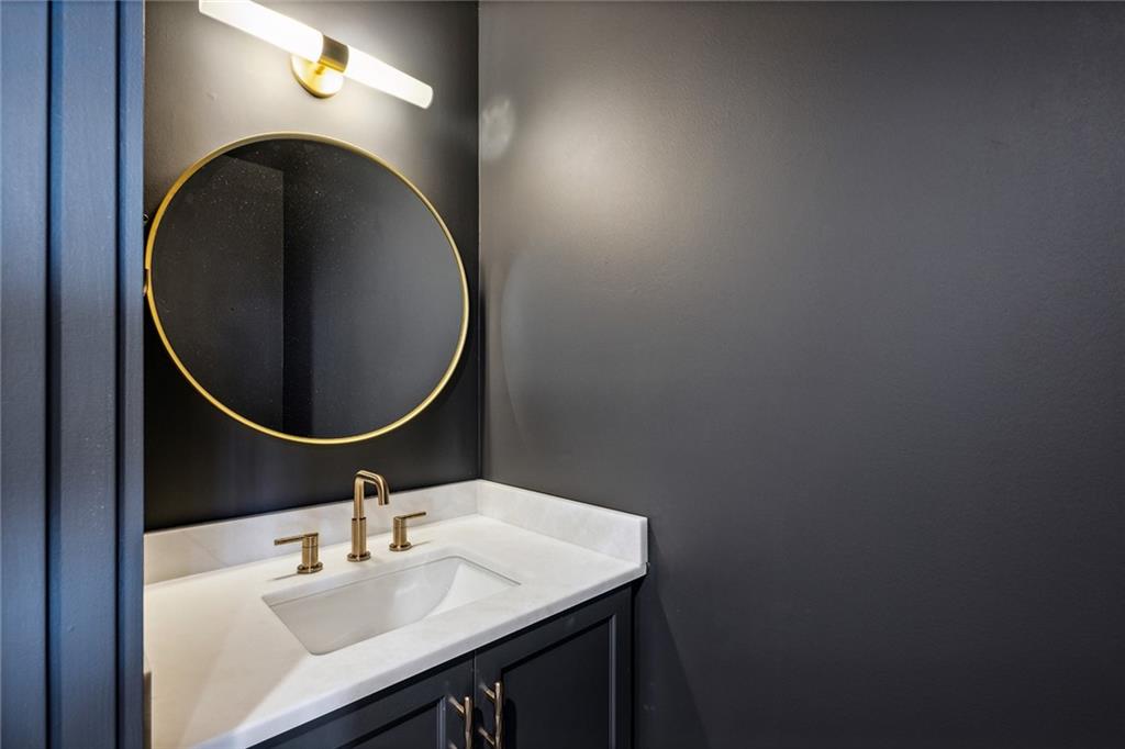 3630 Peachtree Road Northeast, Unit 3106 Atlanta, GA 30326 - Photo 8 of 41 a bathroom with a sink vanity and a mirror