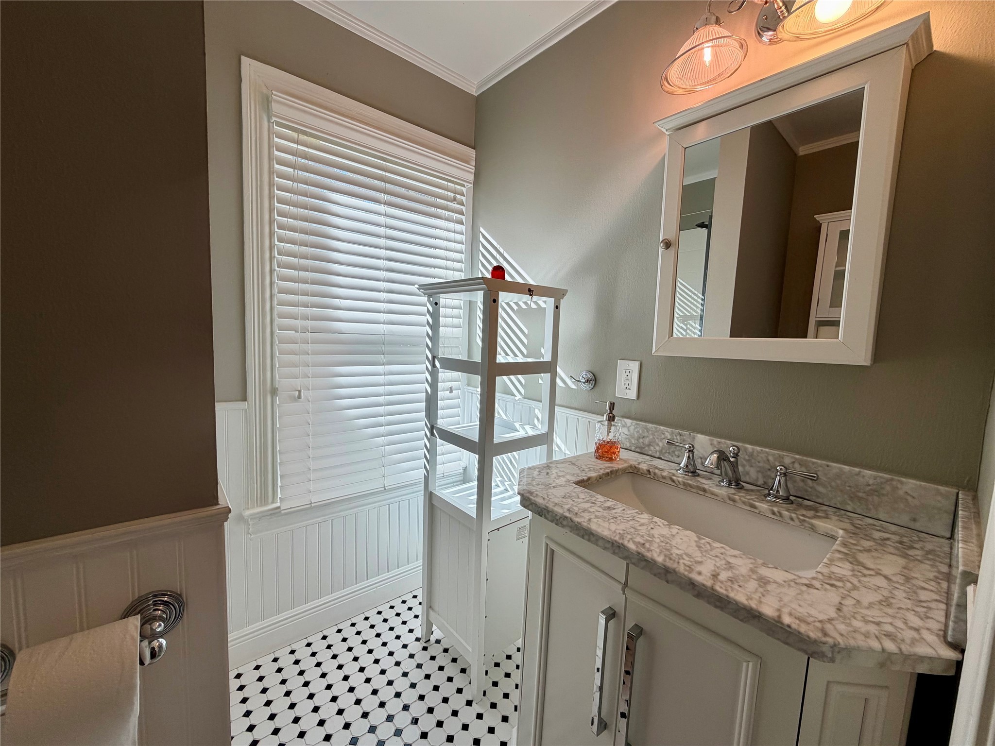 1621 Cherryhurst Street Houston, TX 77006 - Photo 16 of 21 a bathroom with a granite countertop sink and a mirror