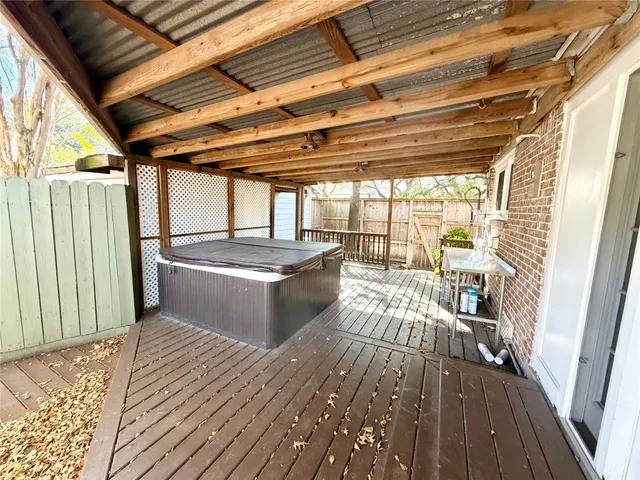 a view of a porch with wooden floor
