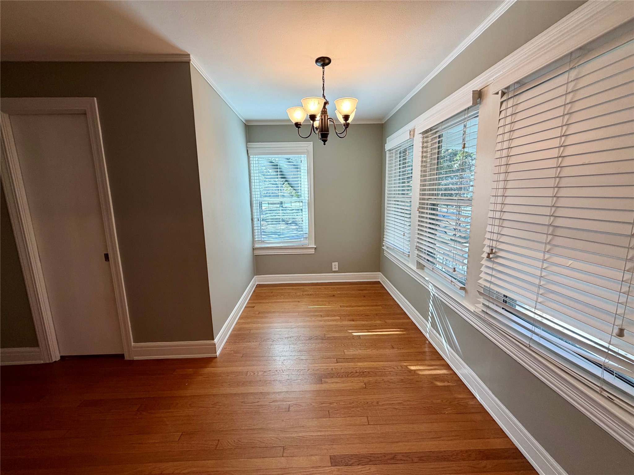 1621 Cherryhurst Street Houston, TX 77006 - Photo 8 of 21 a view of a room with wooden floor and windows