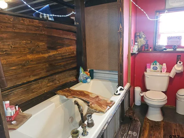 a bedroom with a bed and a table in it