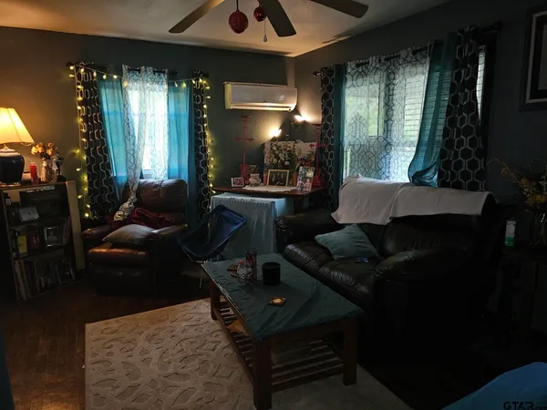 a living room with furniture and a large window